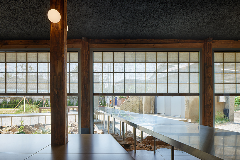 traditional wooden hanok roof frame tops nomal's renovated restaurant in korea - 5