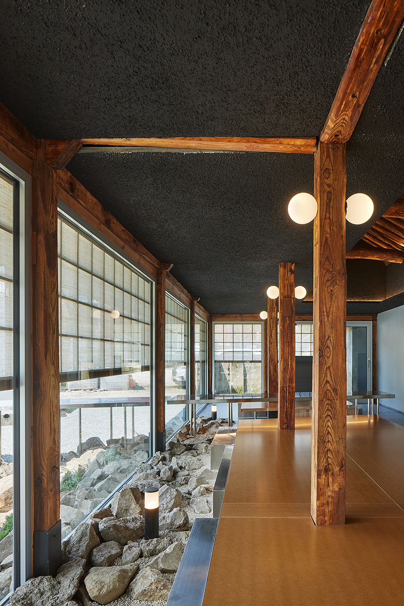 traditional wooden hanok roof frame tops nomal's renovated restaurant in korea - 4