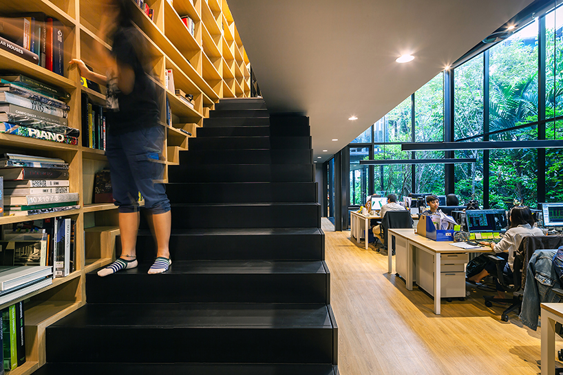 black timber cladding envelops IDIN architects' tranquil office space in bangkok designboom