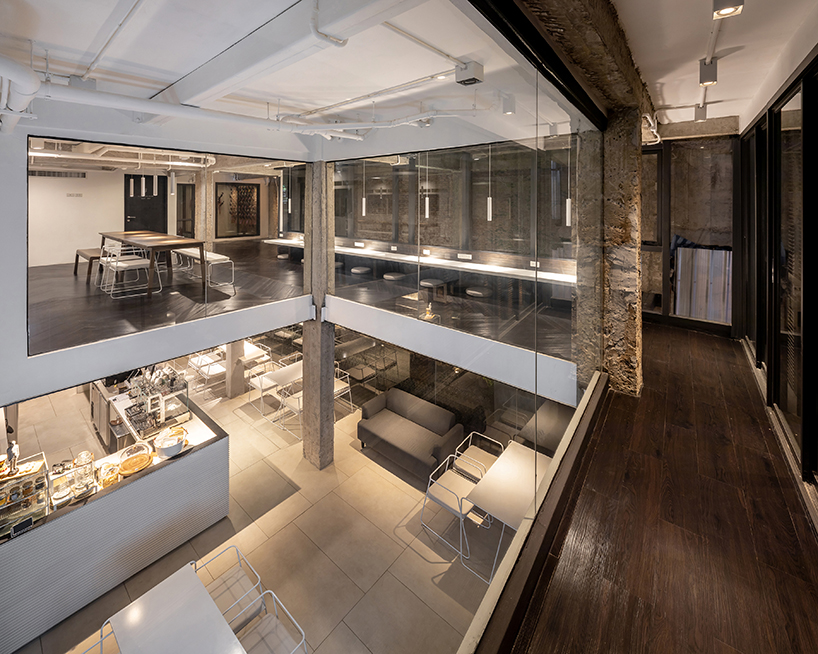 IDIN architects completes pa prank hostel in bangkok with façade of black shutters