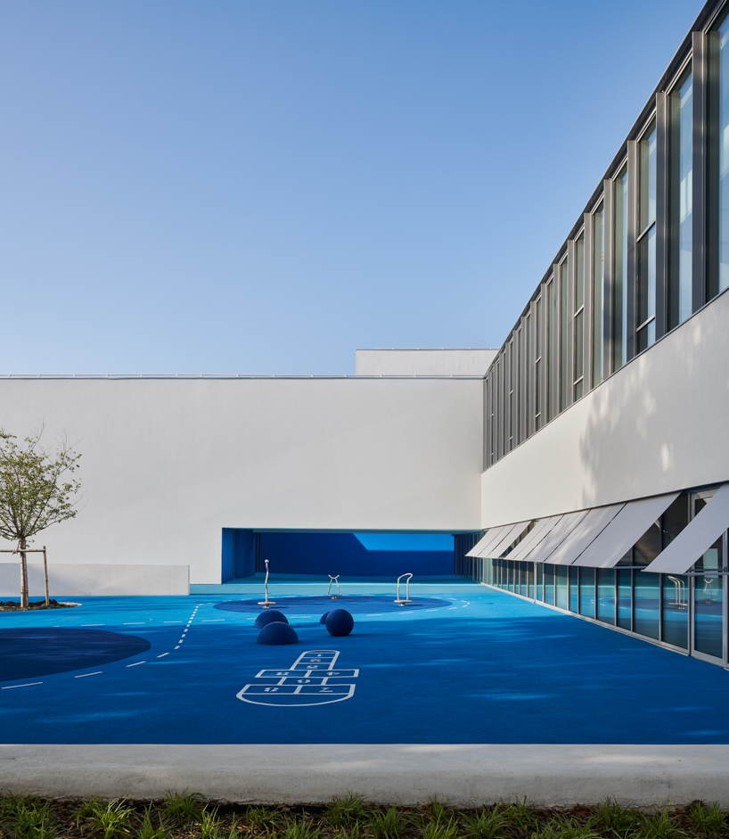 dominique coulon applies varying shades of blue to school group 'rené beauverie' in france