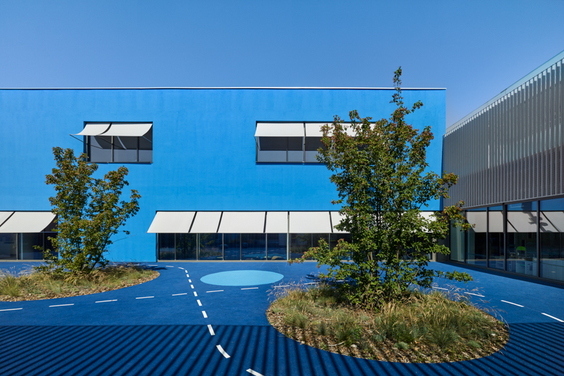 dominique coulon applies varying shades of blue to school group 'rené beauverie' in france