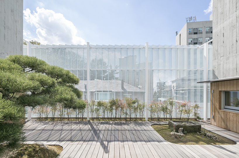 BCHO architects wraps perforated aluminum panels around a multi-use building in seoul designboom