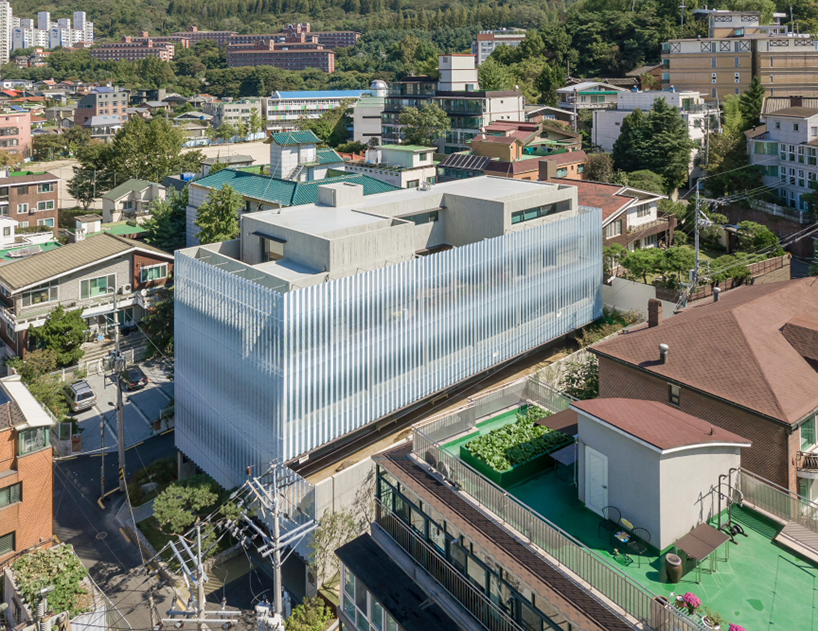 BCHO architects wraps perforated aluminum panels around a multi-use building in seoul designboom
