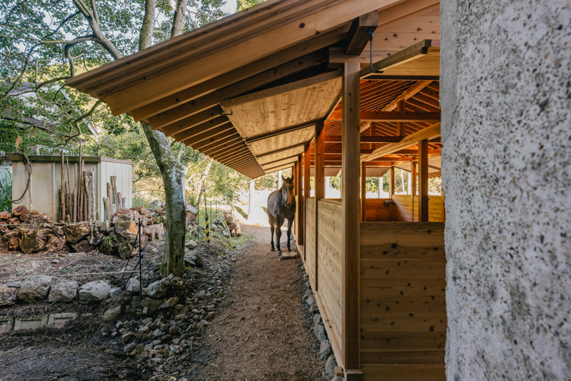 locally sourced wood and traditional japanese joinery shape 2m26's horse stable in kyoto