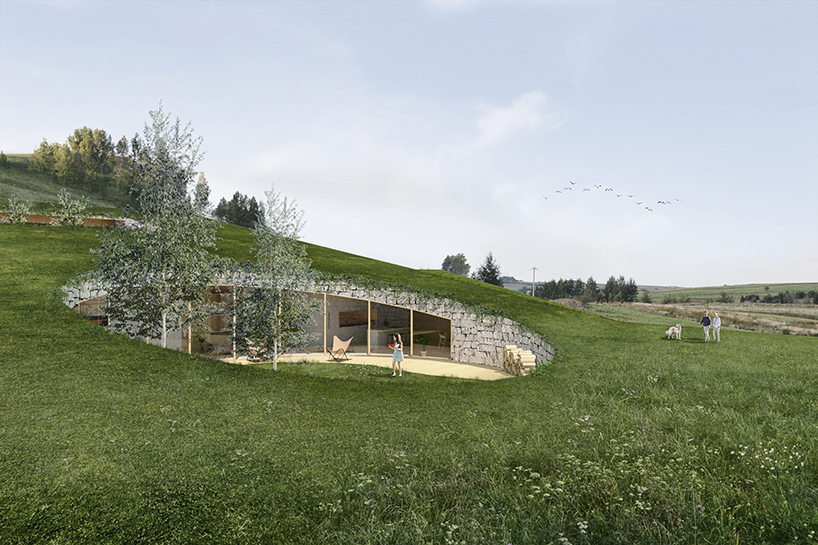 adrian kasperski weaves house into the hills of polish landscape