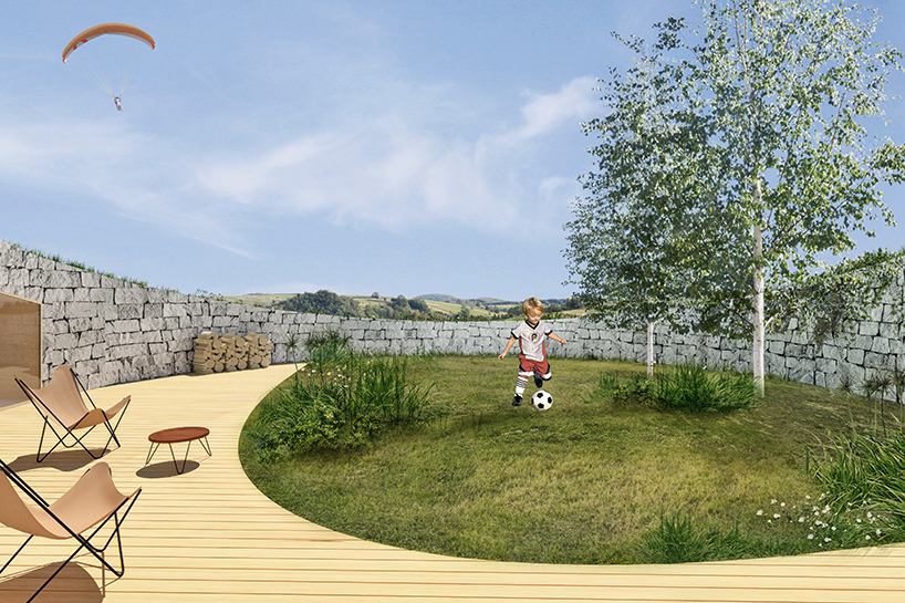 adrian kasperski weaves house into the hills of polish landscape - 1