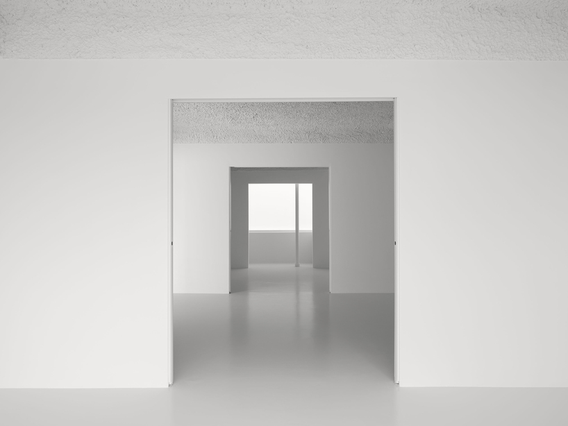 hanghar negates architecture in bare, abstract house responding to social standards