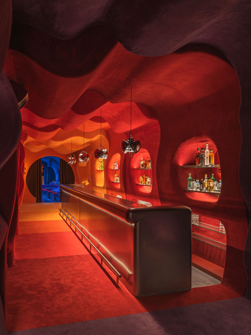 retro cocktail bar with multi-chrome lighting and curved steel hides behind barcelona focacceria - 3
