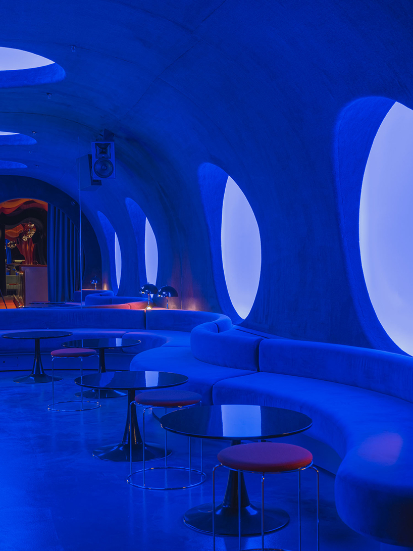 retro cocktail bar with multi-chrome lighting and curved steel hides behind barcelona focacceria - 12