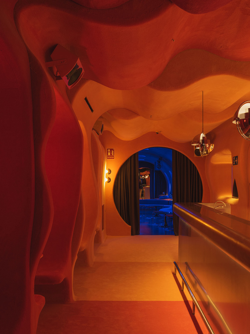 retro cocktail bar with multi-chrome lighting and curved steel hides behind barcelona focacceria - 5