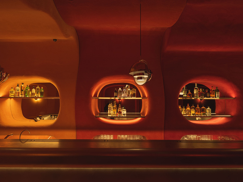 retro cocktail bar with multi-chrome lighting and curved steel hides behind barcelona focacceria - 2