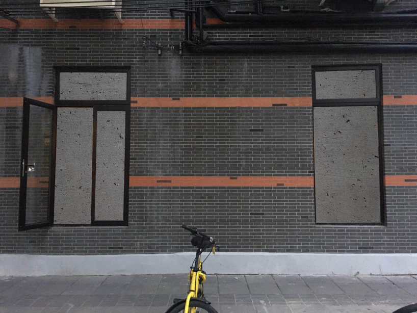 DEVOLUTION turns two windows into a contemporary art exhibition in shanghai designboom