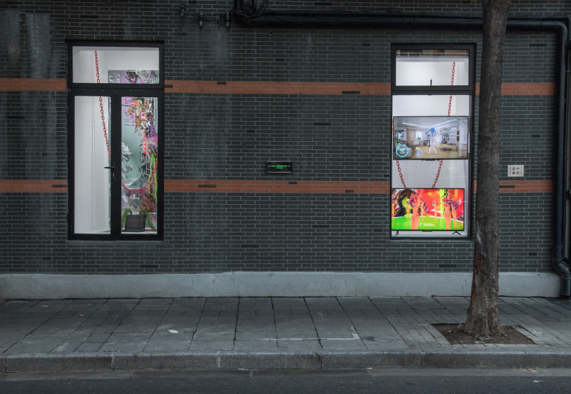DEVOLUTION turns two windows into a contemporary art exhibition in shanghai designboom
