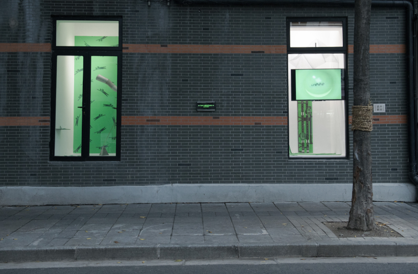 DEVOLUTION turns two windows into a contemporary art exhibition in shanghai designboom