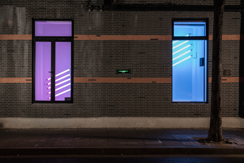 DEVOLUTION turns two windows into a contemporary art exhibition in shanghai designboom
