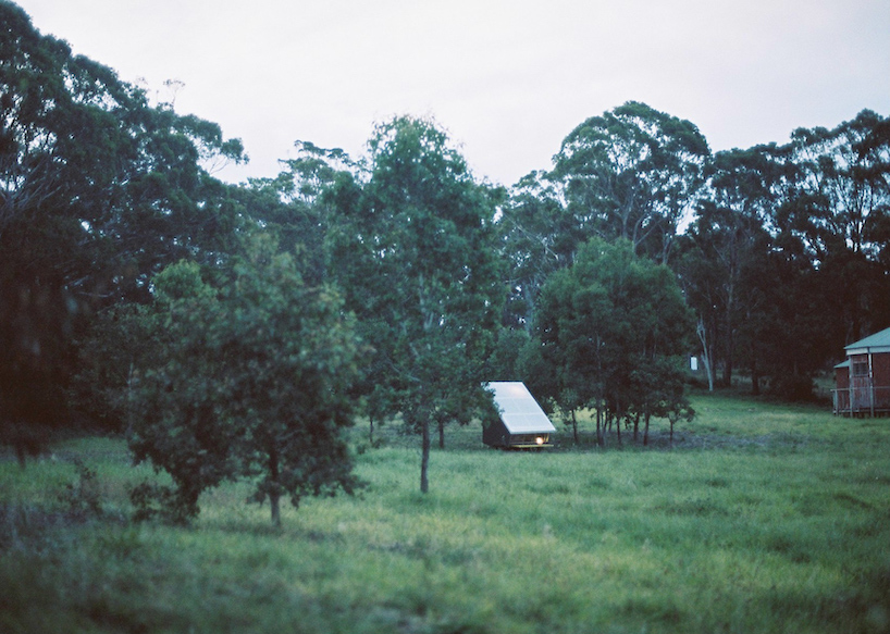 portable tiny house 'the coop' provides shelter within australian landscape