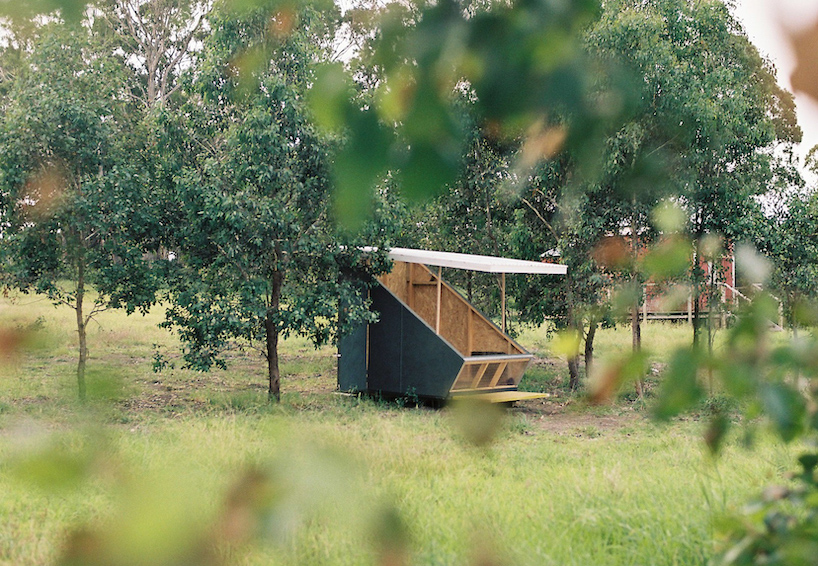 portable tiny house 'the coop' provides shelter within australian landscape