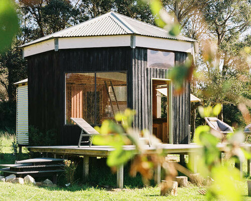trouthouse revitalizes derelict museum as charred wood cabin in rural australia