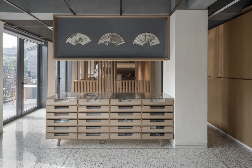 golucci brings japanese-style lines to a fan workshop in beijing designboom
