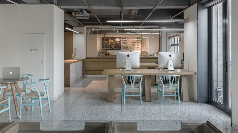 golucci brings japanese-style lines to a fan workshop in beijing designboom