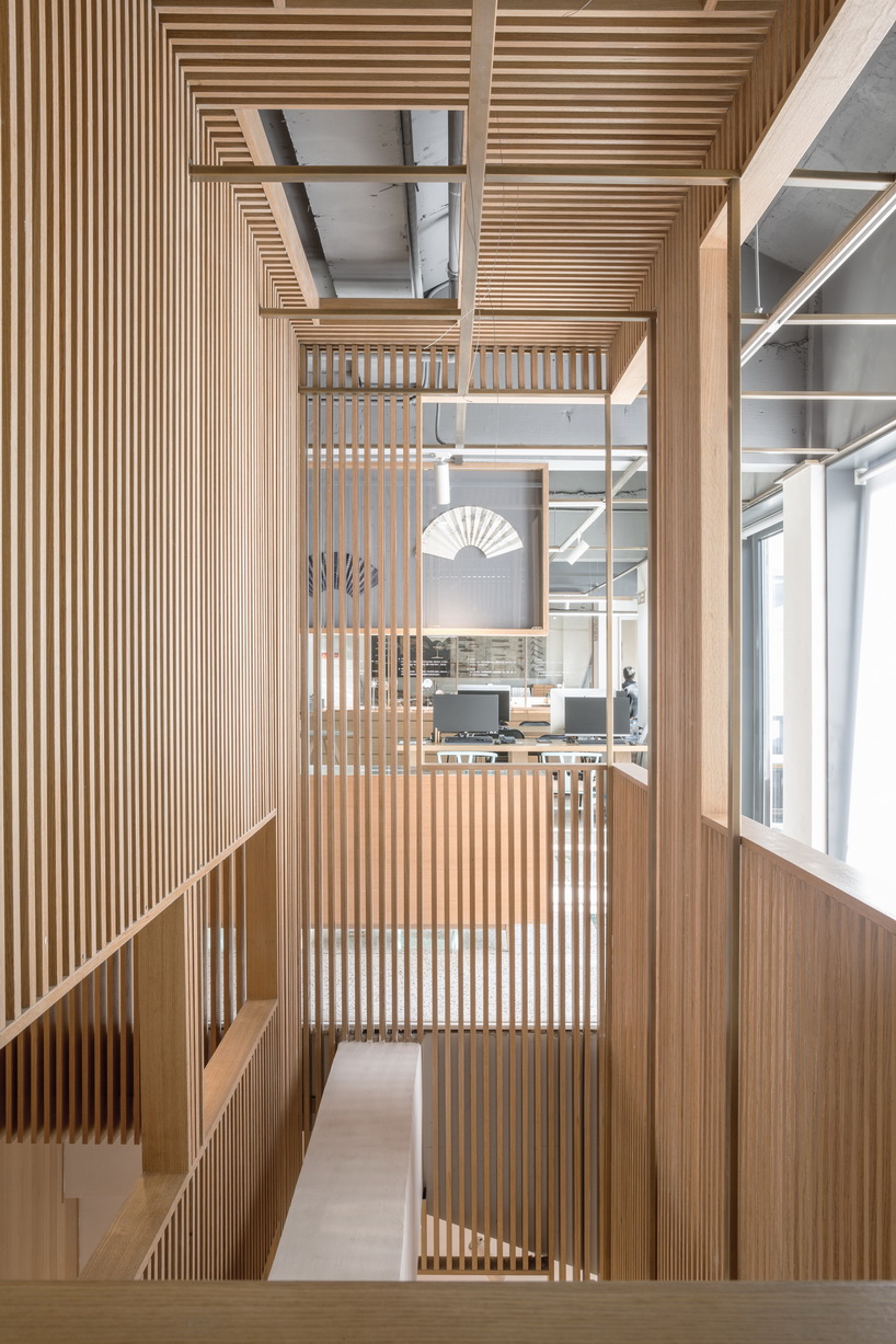 golucci brings japanese-style lines to a fan workshop in beijing designboom