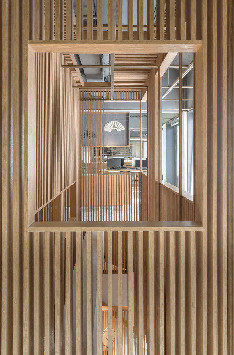 golucci brings japanese-style lines to a fan workshop in beijing designboom