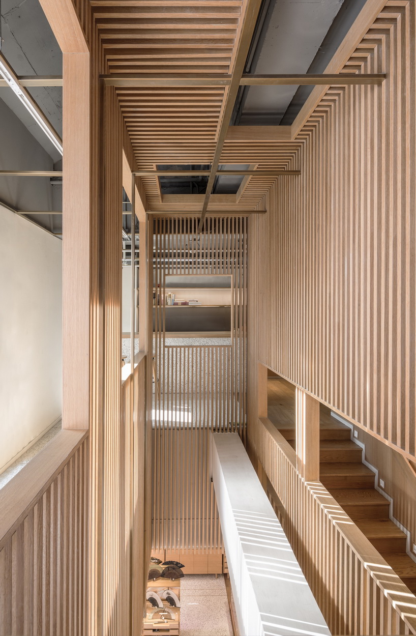 golucci brings japanese-style lines to a fan workshop in beijing designboom