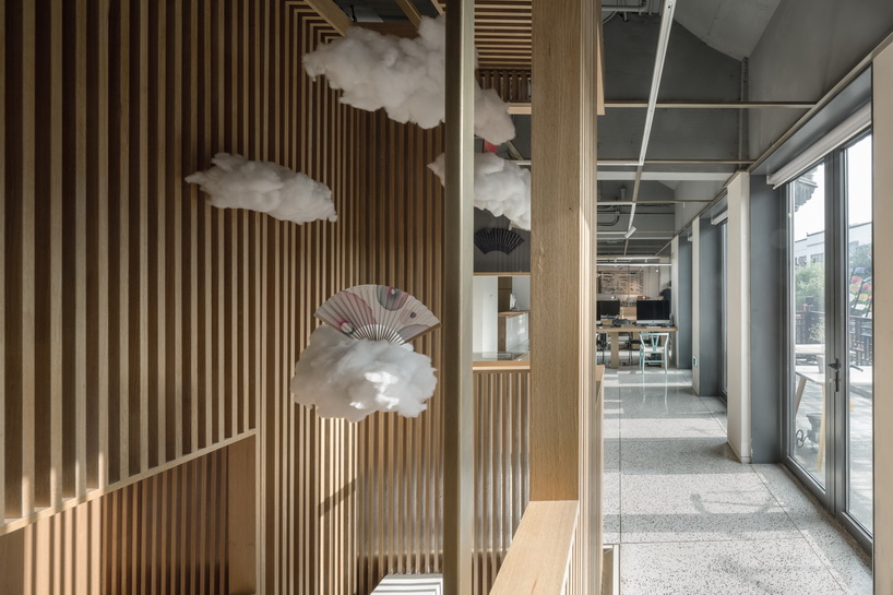 golucci brings japanese-style lines to a fan workshop in beijing designboom