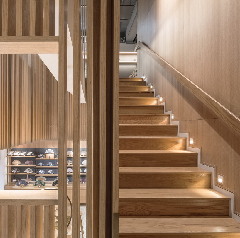 golucci brings japanese-style lines to a fan workshop in beijing designboom