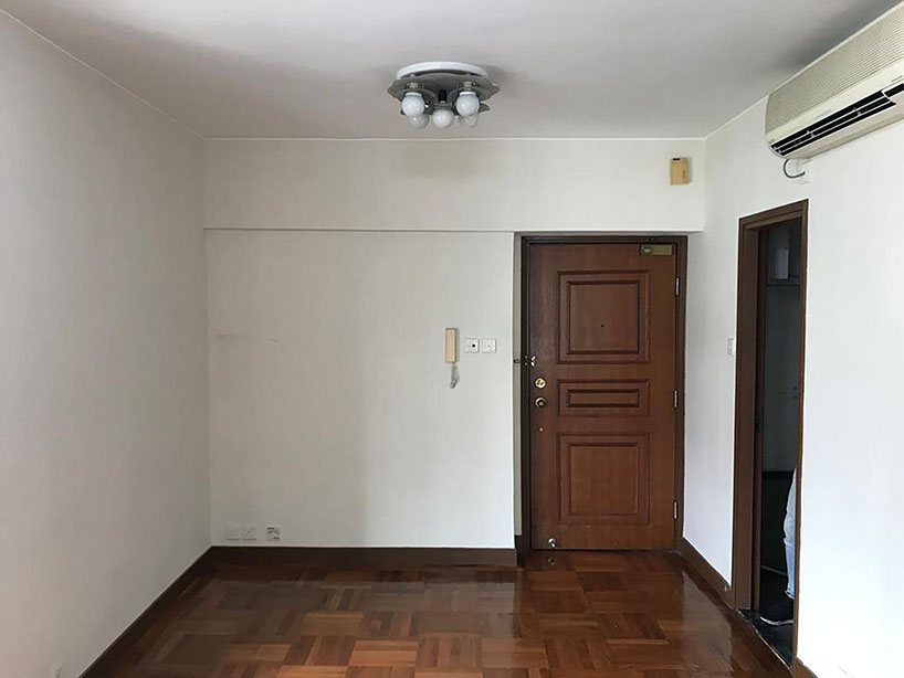 absence from island completes apartment interior in hong kong with rattan, wood + terrazzo