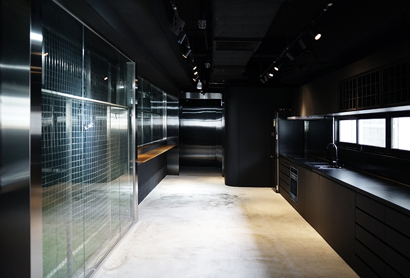 absence from island + studio etain ho turn a factory unit into a soccer pitch designboom