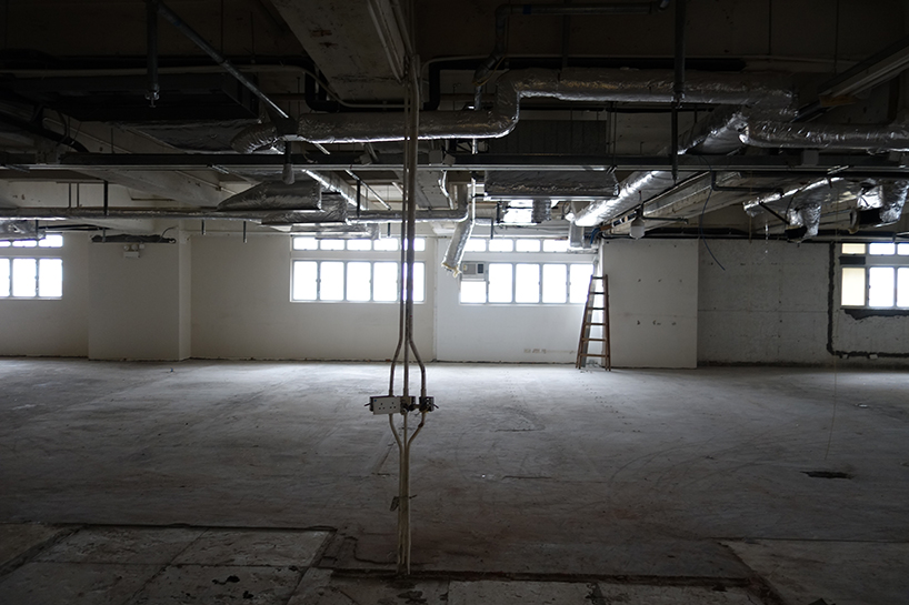 absence from island + studio etain ho turn a factory unit into a soccer pitch designboom