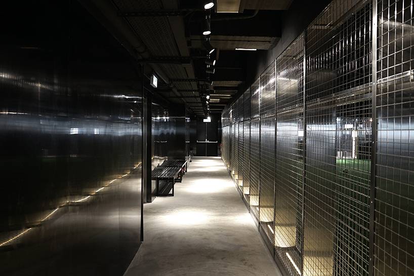 absence from island + studio etain ho turn a factory unit into a soccer pitch designboom
