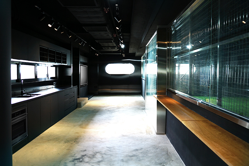 absence from island + studio etain ho turn a factory unit into a soccer pitch designboom