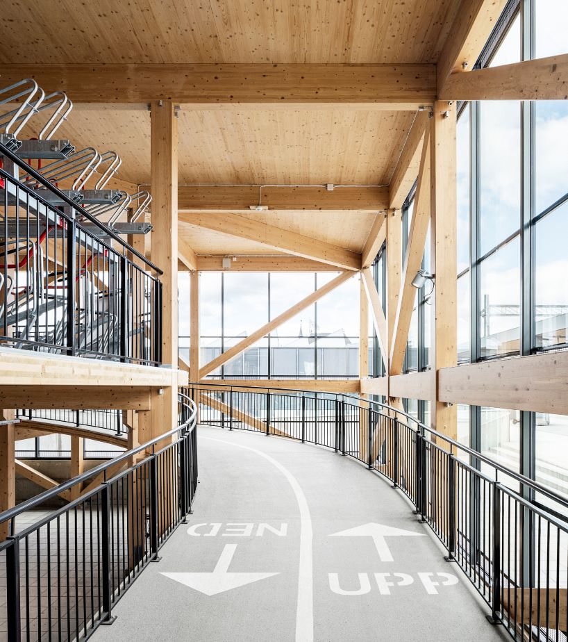 tengbom architects design sustainable triangular-shaped bicycle garage in sweden 