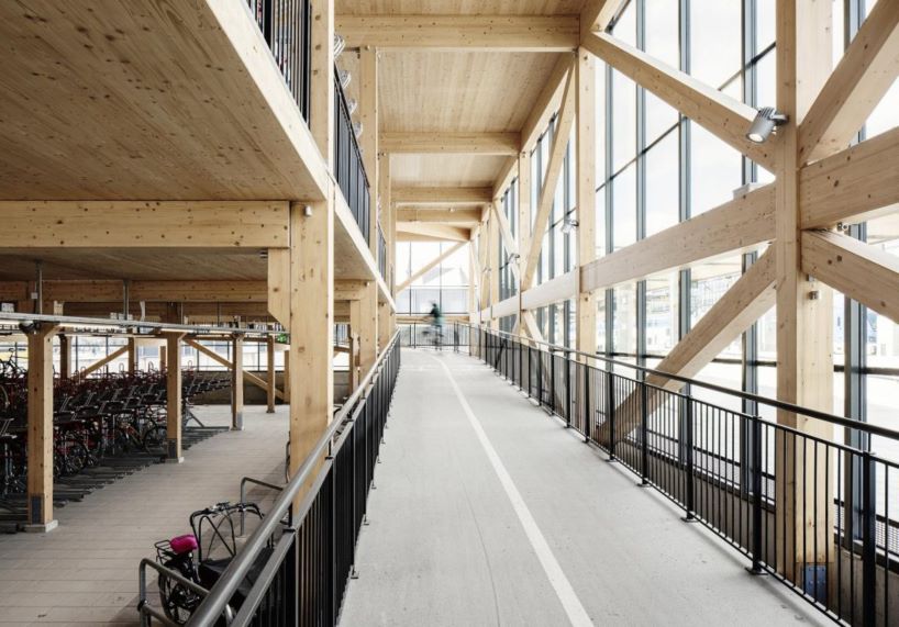 tengbom architects design sustainable triangular-shaped bicycle garage in sweden 