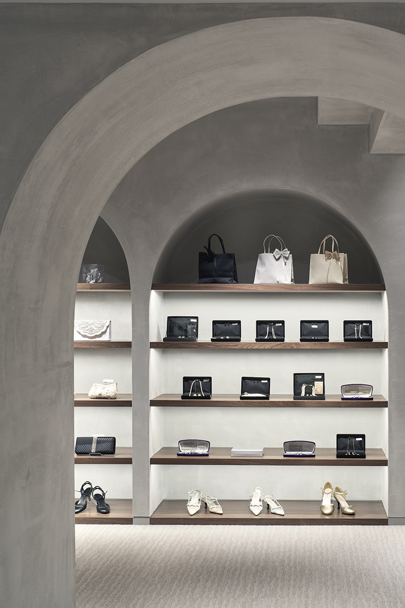 tsutsumi and associates forms labyrinth store in japan with romanesque concrete arches