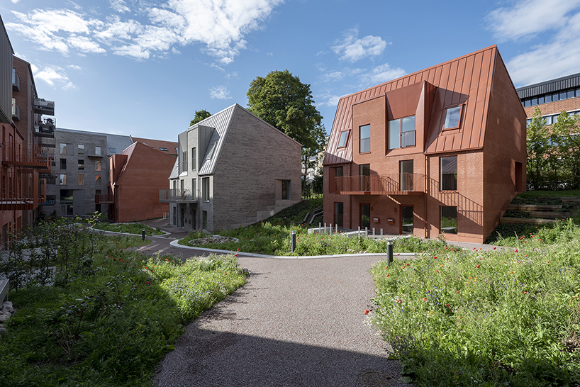 CEBRA designs a 'cozy cobbled streetscape' for aarhus apartments designboom