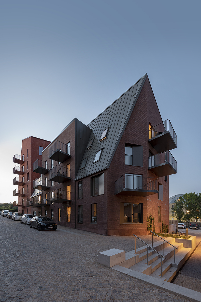 CEBRA designs a 'cozy cobbled streetscape' for aarhus apartments designboom