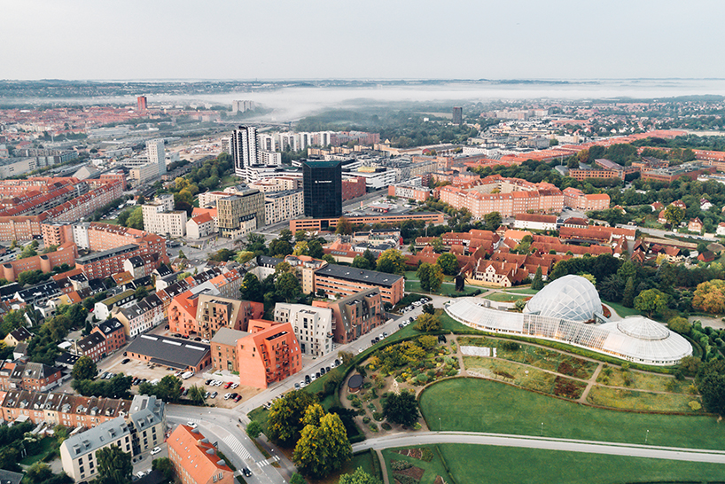 CEBRA designs a 'cozy cobbled streetscape' for aarhus apartments designboom