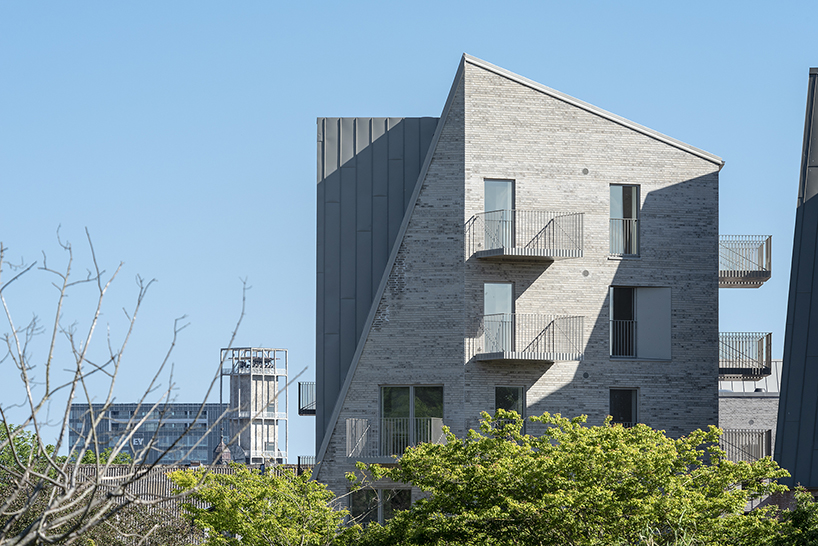 CEBRA designs a 'cozy cobbled streetscape' for aarhus apartments designboom