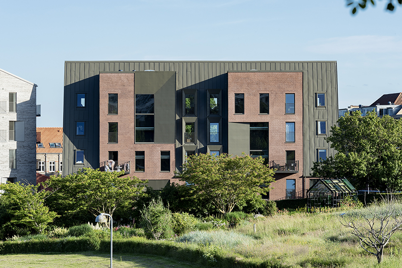 CEBRA designs a 'cozy cobbled streetscape' for aarhus apartments designboom