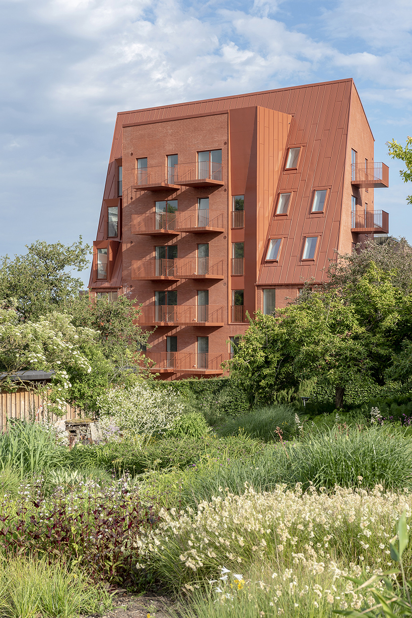 CEBRA designs a 'cozy cobbled streetscape' for aarhus apartments designboom