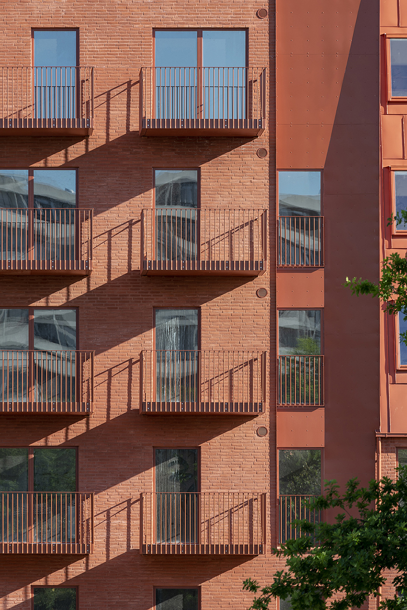 CEBRA designs a 'cozy cobbled streetscape' for aarhus apartments designboom