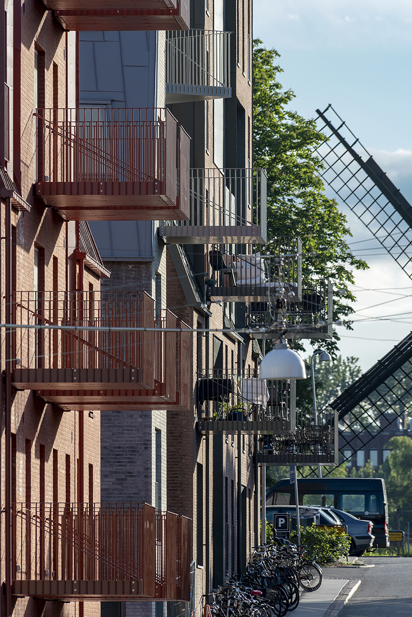 CEBRA designs a 'cozy cobbled streetscape' for aarhus apartments designboom