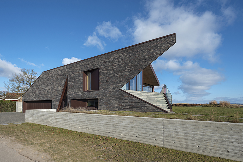 cebra completes danish seaside villa with sculptural roof 2
