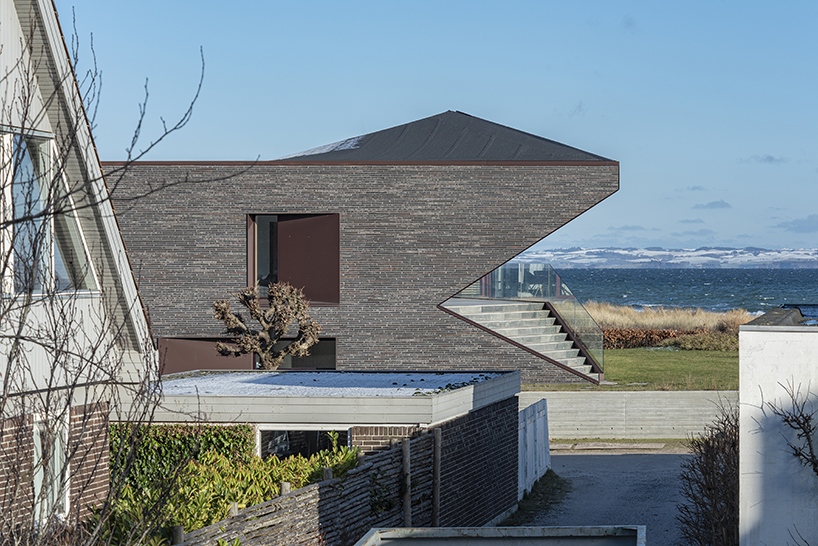 cebra completes danish seaside villa with sculptural roof 3