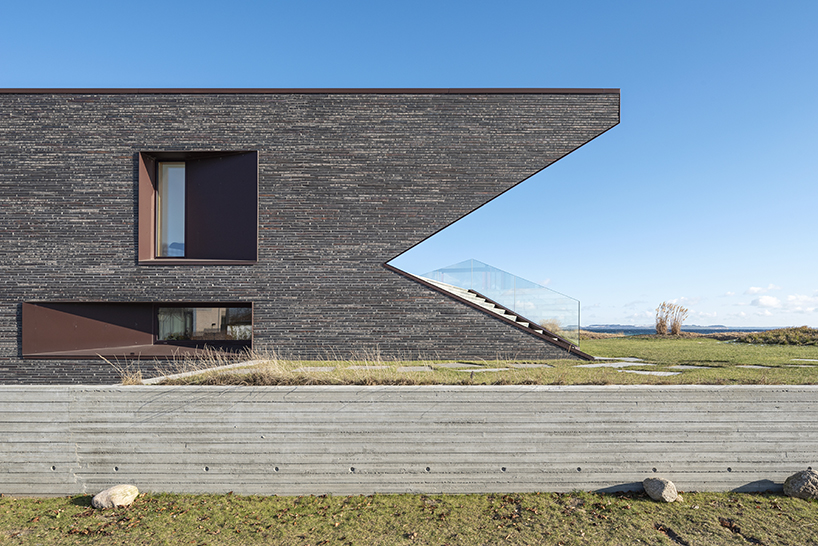 cebra completes danish seaside villa with sculptural roof 4