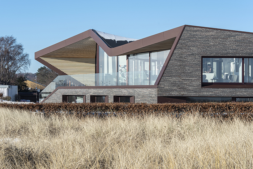 cebra completes danish seaside villa with sculptural roof 5